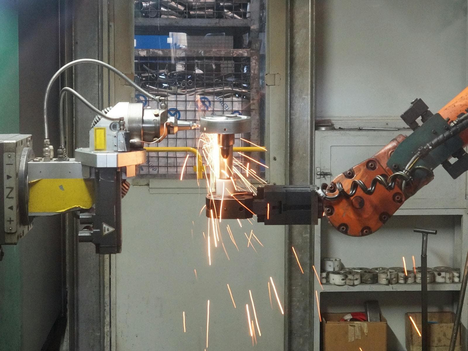 Specialized machinery with a precision robotic arm in a manufacturing workshop.